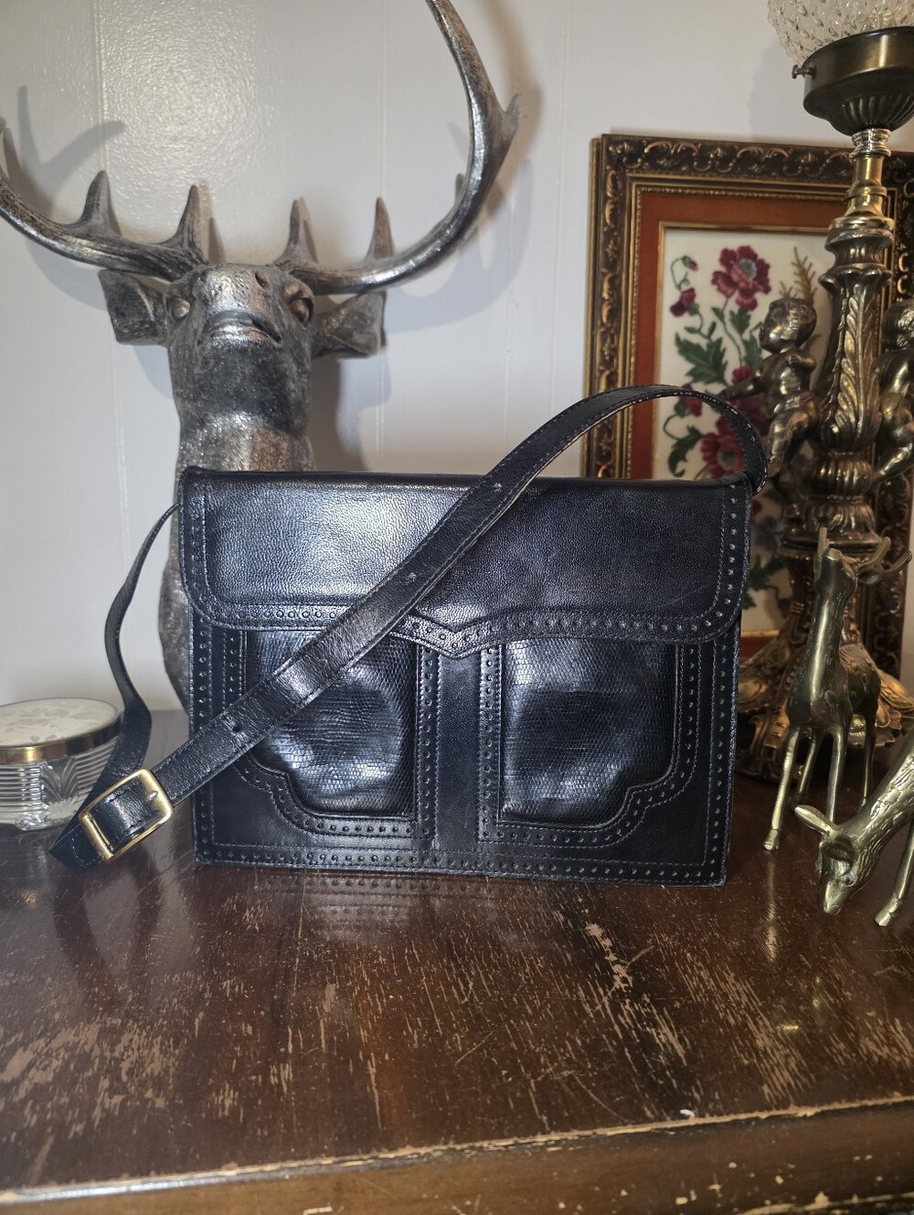 Vintage Yves Saint Laurent black leather convertible shoulder bag.